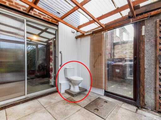 A three bedroom home priced at £130,000 has caught attention for its unusual layout, featuring a fully plumbed toilet sitting openly inside a glass conservatory